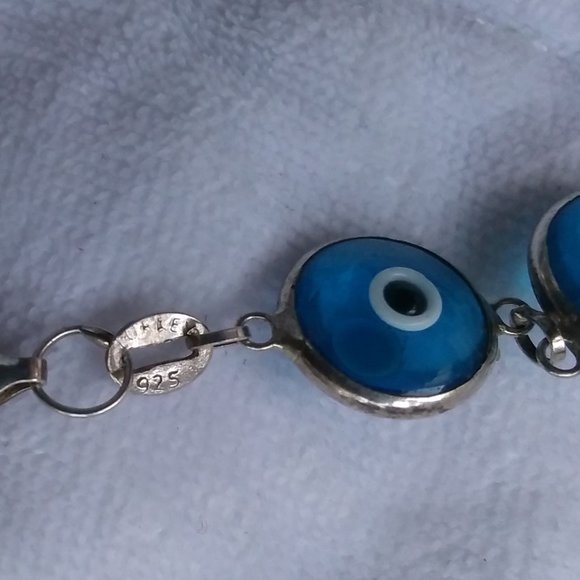 Bracelet, 11 semi-transparent blue pieces with black and white eye-like parts - Picture 3 of 3